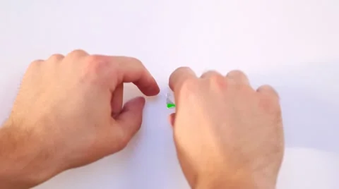 Making hole in the white paper Stock Footage 7895636