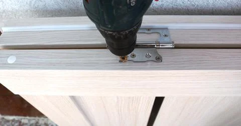 Making holes for installing door hinges Stock Photos