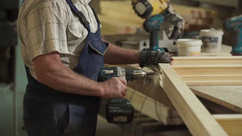 Making Holes In Planks Of Window Frame With Woodworking Drill Instrument Stock Footage 187626677