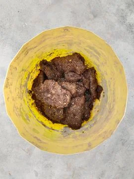 Making home made compost using cow dung in plastic container. home made com.. Stock Photos