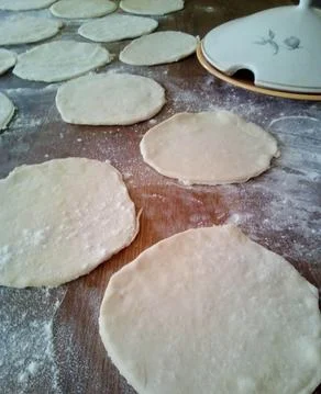 Making of: homemade Arabic bread ready to be rolled along with the kebab Stock Photos