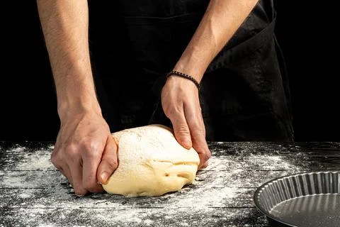 Making homemade bread. Step-by-step instruction. The cook shapes the dough Foto stock