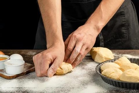 Making homemade bread. Step-by-step instruction. The cook shapes the dough Фото