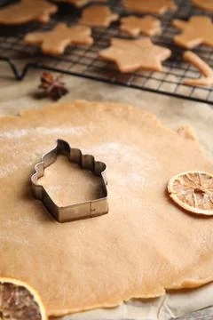 Making homemade Christmas cookies. Dough and cutter on table, closeup Stock Photos