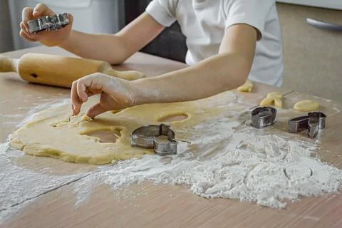 Making homemade cookies using baking dishes. The child's hands, himself makes Stock Photos