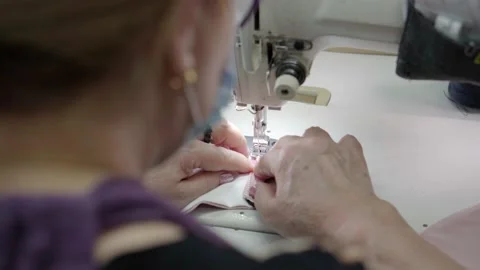 The making a homemade face masks on a sewing machine, close up. Stock Footage 147307907