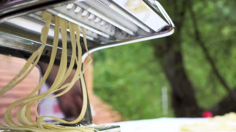 Making homemade noodles with rolling machine from special dough Stock Footage 136560993