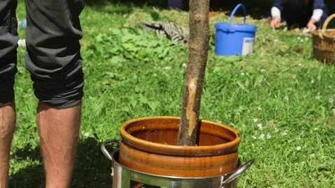 Making a Homemade Torch. Torch Tip Wrapped With Rags Is Dipped In Fuel Liquid Stock Footage 257973283