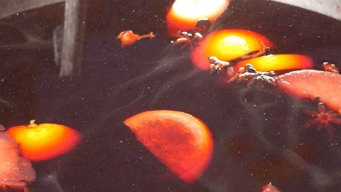 Making hot alcohol, mulled wine for sale at country fair. Glintwine from red Stock Footage 88415901