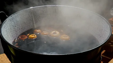 Making hot alcoholic mulled wine for sale Stock Footage 119527791