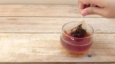Making a hot tea with a instant tea bag Stock Footage 145461231