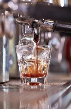 Making ice coffee on espresso machine Stock-Fotos