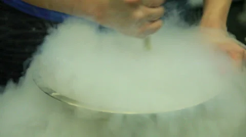 Making ice cream with cold liquid nitrogen at a science fair. Stock Footage 24534004