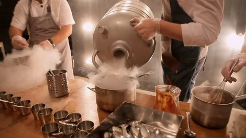 Making ice cream with cold liquid. Beautiful evaporation from liquid nitrogen Stock Footage 70315388