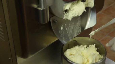 Making Ice Cream: Ice cream Comes Out Of The Gelato Maker Stock Footage