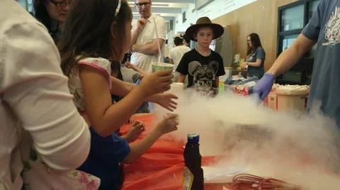 Making ice cream with liquid nitrogen at a science fair. Stock Footage 50036800
