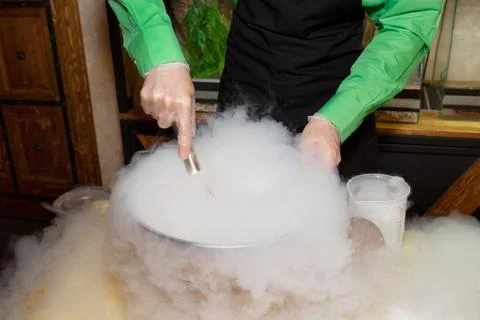 Making ice cream with liquid nitrogen. Show program of the chef for the holiday Stock Photos