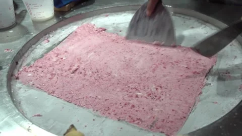 Making ice cream rolls on cold plate Stock Footage 274016789