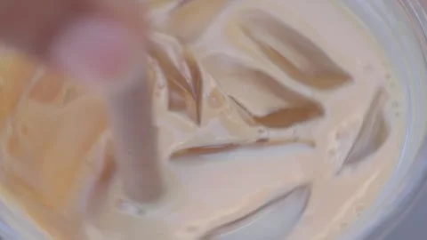 Making iced coffee with cream and ice Stock Footage 340544760