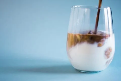Making of iced coffee in a glass Stock Photos