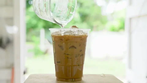 Making iced coffee on table. Stock Footage 263325138