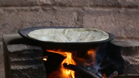 Making Indian bread in village Stock Footage 165937685