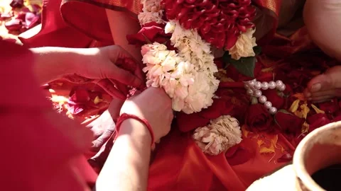 Making indian bride wear silver anklet jewellery on her feet during an Stock Footage 143300085