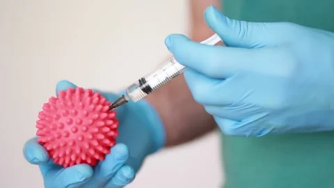 Making injection and holding pink ball Stock Footage 157355448