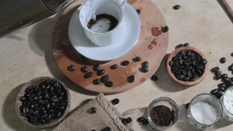 Making instant coffee, bar keeper pouring coffee powder into a cup Stock Footage 143257192