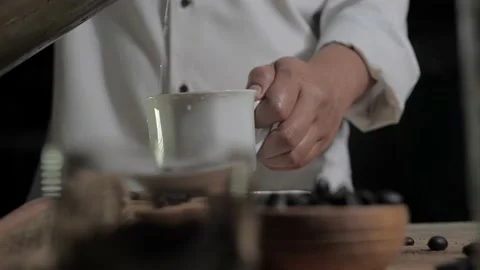 Making instant coffee, bar keeper pouring coffee powder into a cup Stock Footage 143257544