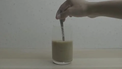 Making instant iced milk coffee Stock Footage 300876769