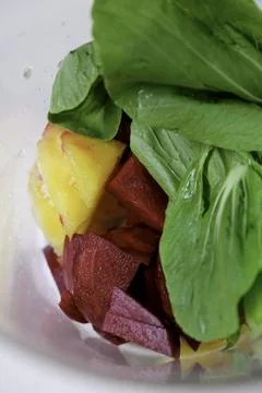Making juice from bok choy, beet, and pineapple. Stock Photos