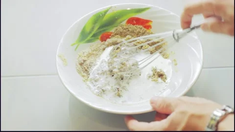 Making Keto Bread Dough, add cream and mix Stock Footage 276615099