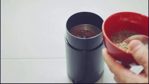 Making keto bread, grinding flax seeds Stock Footage 276600870