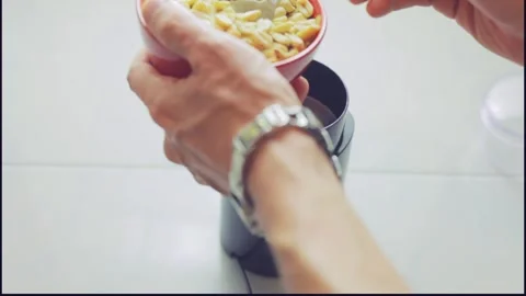 Making Keto Bread: Grinding Peanuts Instead of Flour Stock Footage 276603073