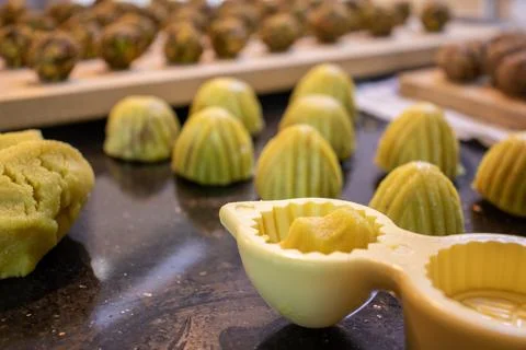 Making keto eid kahk using almond dough pistachio filling and walnut filling Stock Photos