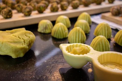 Making keto eid kahk using almond dough pistachio filling and walnut filling Stock Photos