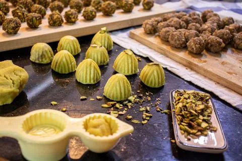 Making keto eid kahk using almond dough pistachio filling and walnut filling Stock Photos