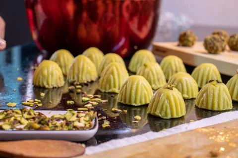 Making keto eid kahk using almond dough and pistachio filling Stock Photos