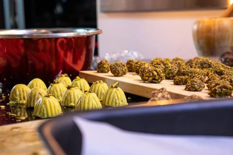 Making keto eid kahk using almond dough and pistachio filling Stock Photos