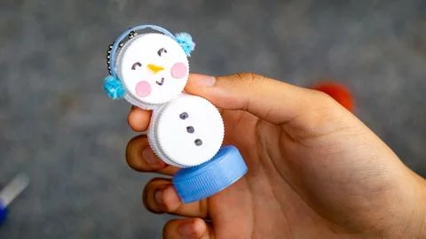 Making key chains from bottle caps and flannel Stock Photos