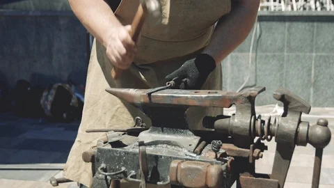 Making the knife out of metal at the forge. Close up blacksmiths hands hittin 動画素材 111265435