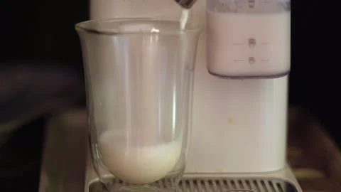 Making latte macchiato with coffee machine at home Stock Footage 316799501