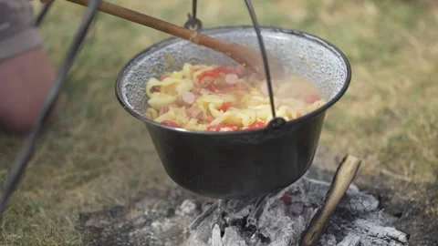 Making lecho in a cauldron outdoors Stock Footage 284454846