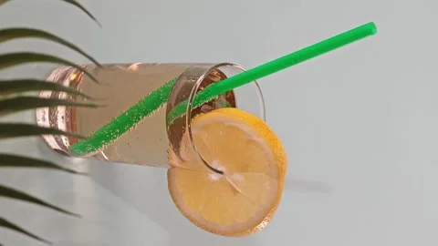 Making lemonade with bubbles and gases in a clear glass at home Stock Footage 339592747