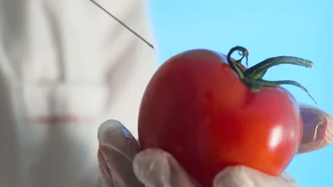 Making lethal injection in apple Stock Footage 105085491