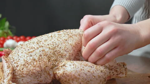 Making a little pouch on a Chicken by separating the skin from the body in 4K. Stock Footage 145108281
