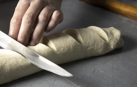 Making a loaf in a bakery by hand. Stock Photos