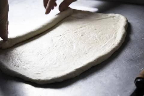 Making a loaf in a bakery by hand. Stock Photos