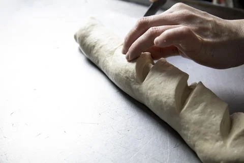 Making a loaf in a bakery by hand. Stock Photos